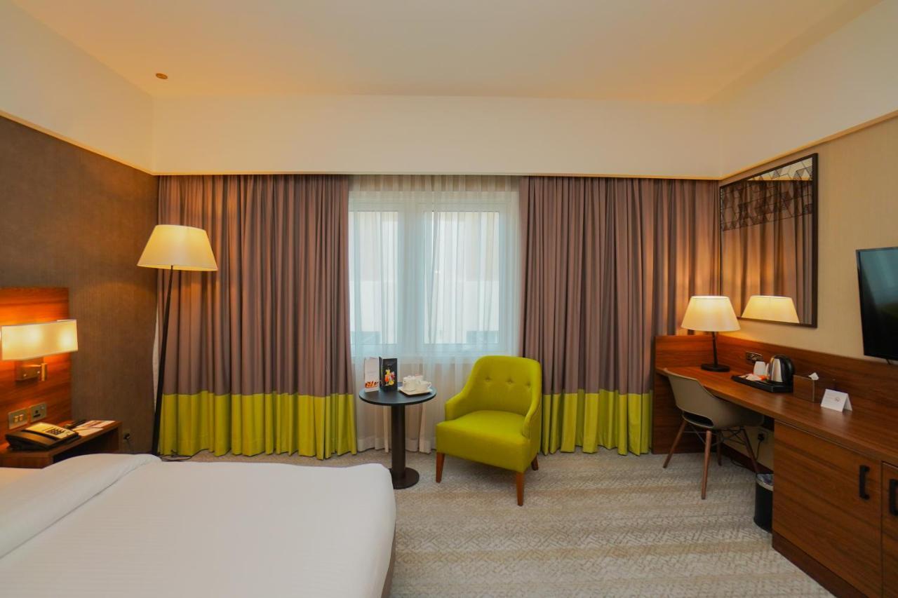The Grand Lux Hotel Doha Ngoại thất bức ảnh A room at the hotel