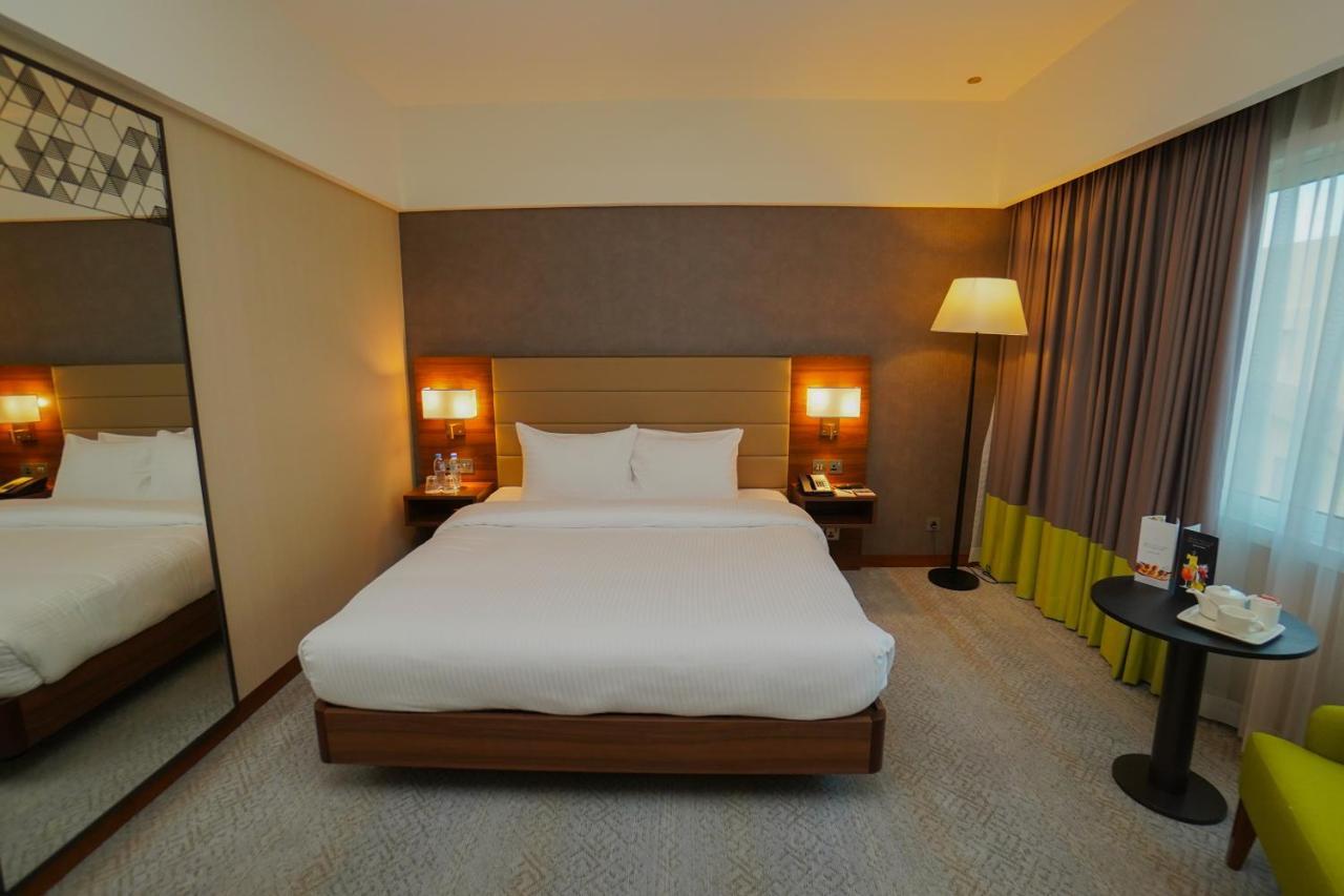 The Grand Lux Hotel Doha Ngoại thất bức ảnh A room at the hotel