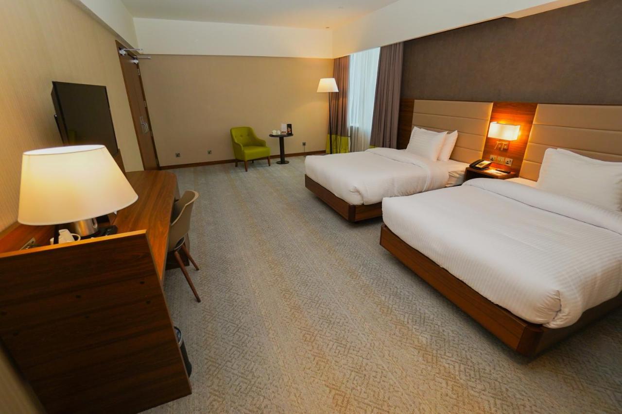 The Grand Lux Hotel Doha Ngoại thất bức ảnh A room at the hotel