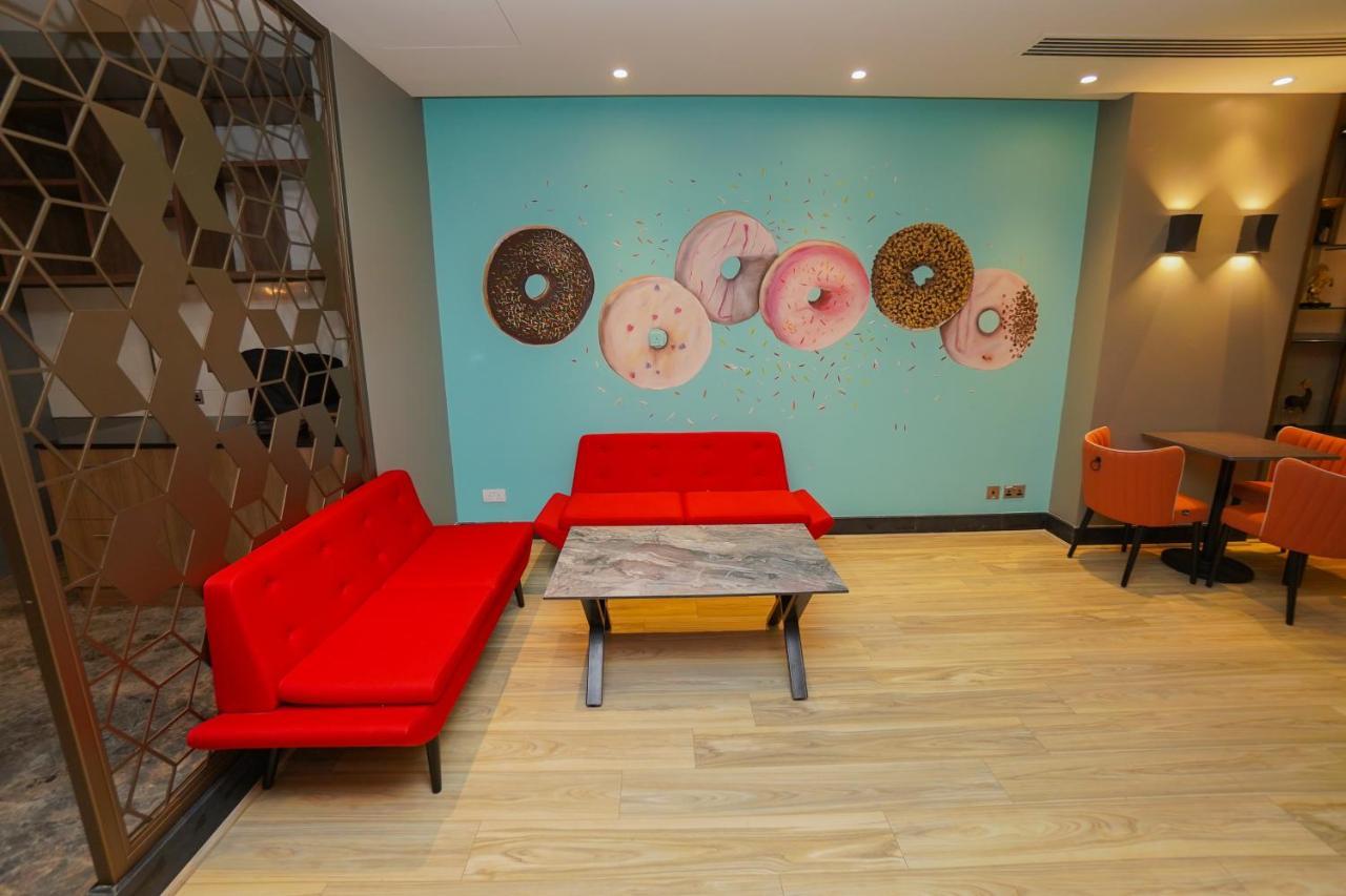 The Grand Lux Hotel Doha Ngoại thất bức ảnh The interior of a Dunkin' Donuts in Paris, France